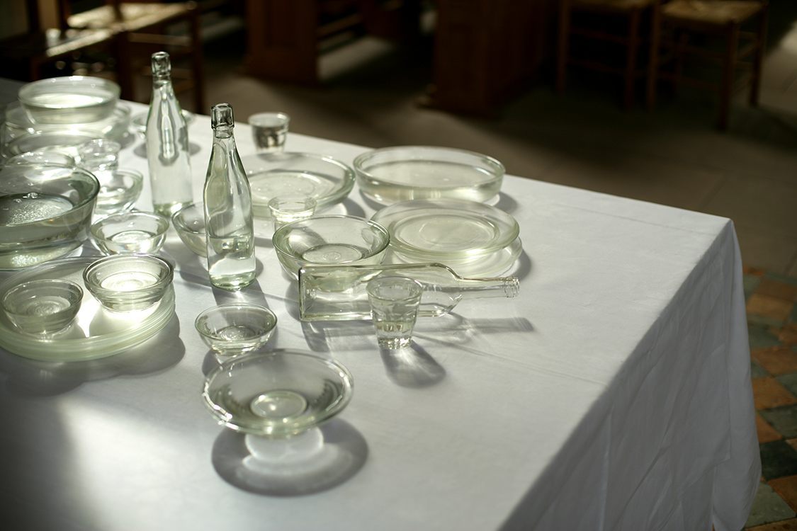 <I>Dining table</I> 2011 glass, water, tablecloth, table 1.10 x 2.40 x 1.15 m installation <I>Capturing the moment</I>